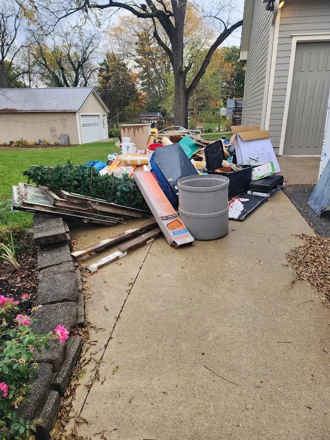 Dumpster being loaded with debris for Estate Cleanout Dumpster Rental in Harrisburg